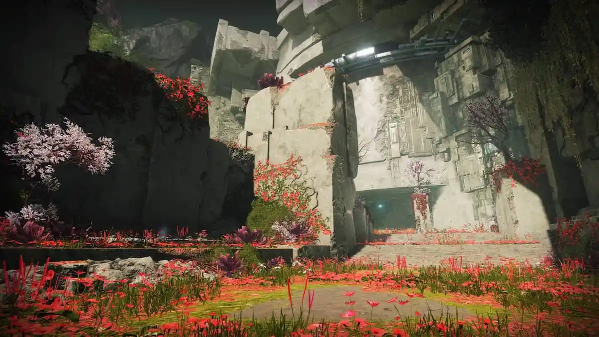 A data pad's faint glow is visible on the left side of this image, which shows a large Vex construction amid the red-and-green palette of the Black Garden.